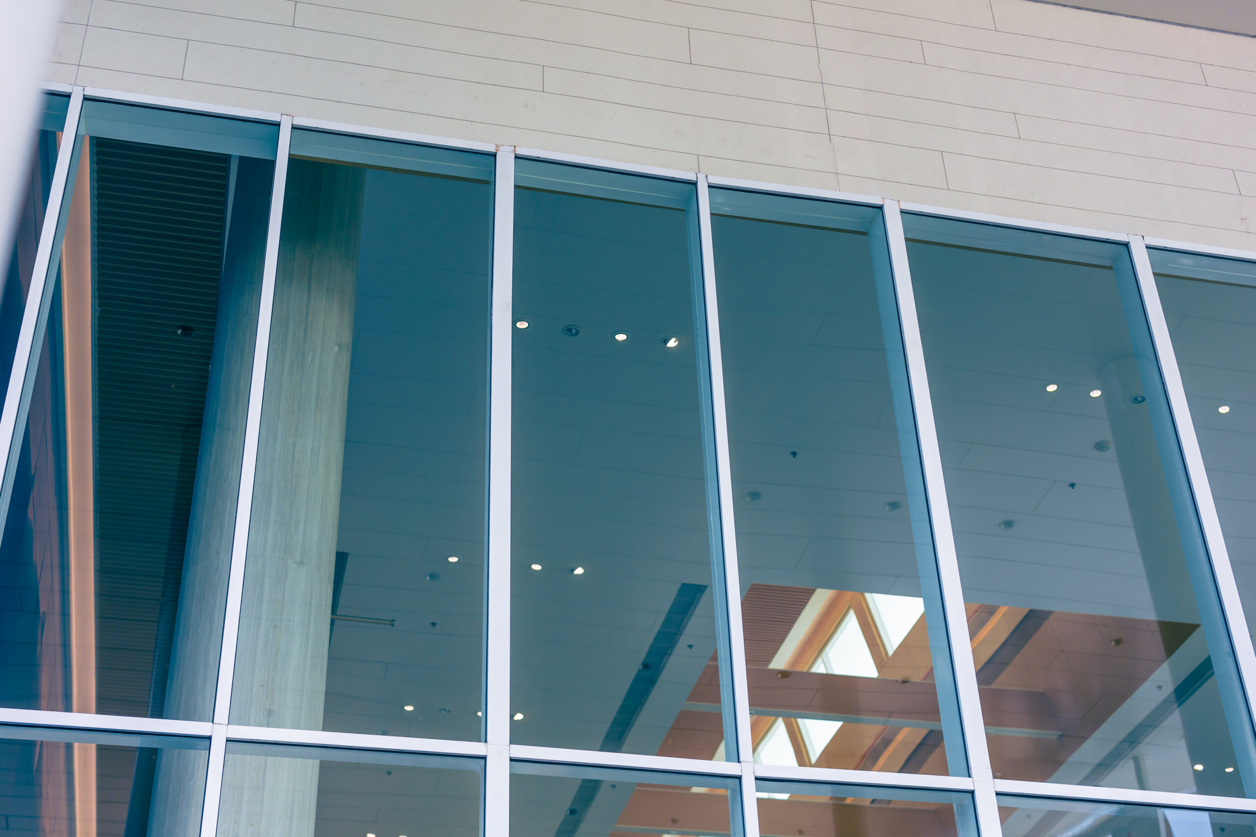 Modern commercial storefront with clear tempered glass windows and entrance doors installed by Integrity Glass.